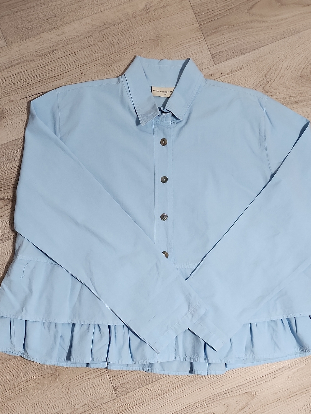 Eleven Stitch Design Light Blue Button-Up Ruffle Hem Top Size Medium